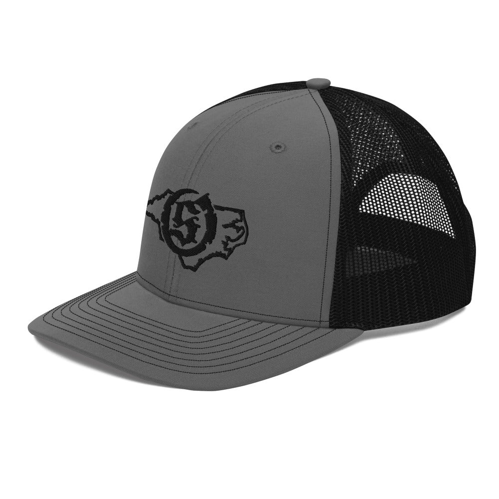 Sail On NC trucker hat in Charcoal/Black with black thread embroidered logo, angled view