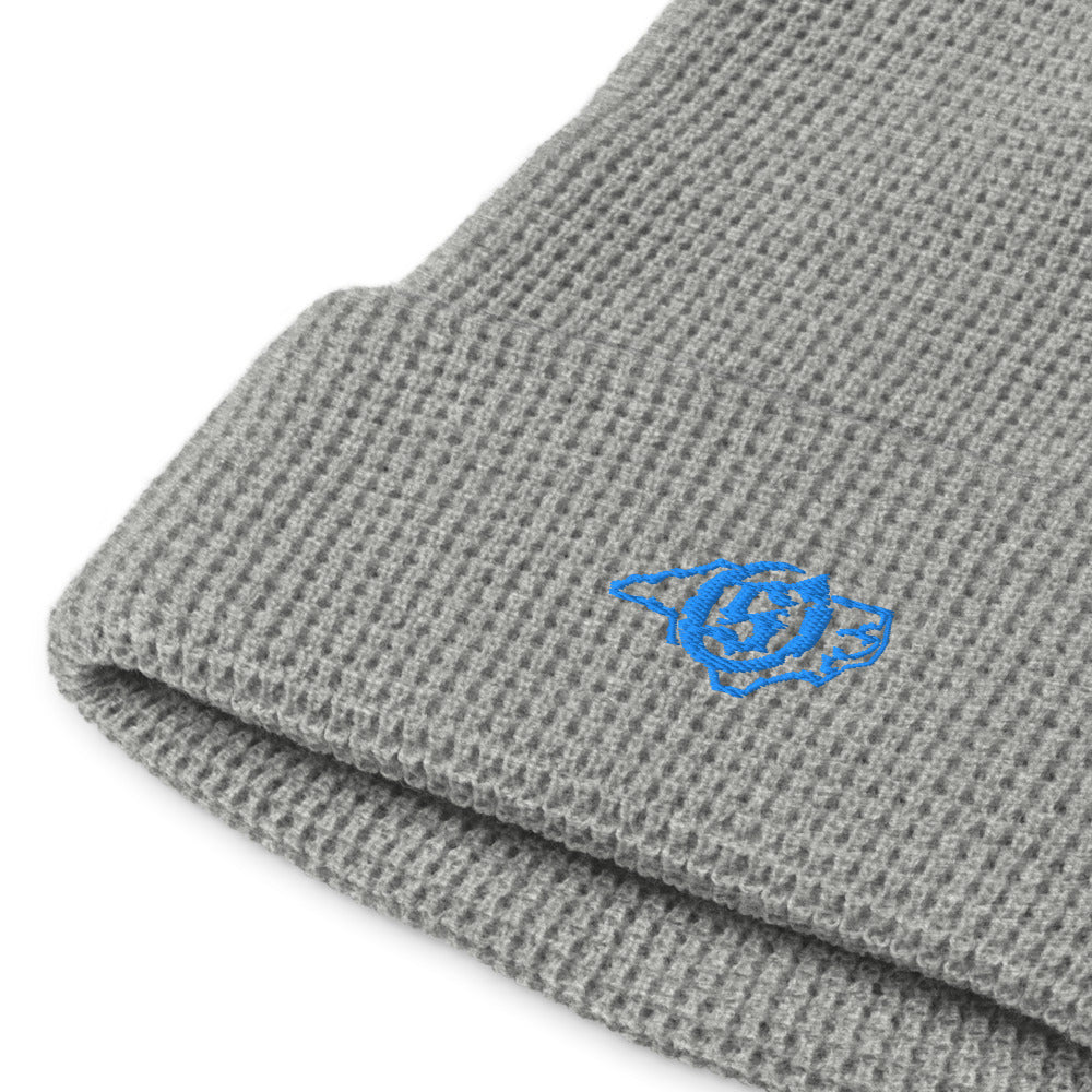 Sail On NC waffle beanie in Heather Grey with blue thread embroidered logo, close-up view