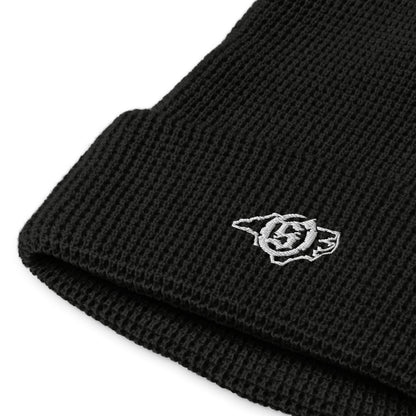 Sail On NC waffle beanie in Black with white thread embroidered logo, close-up view