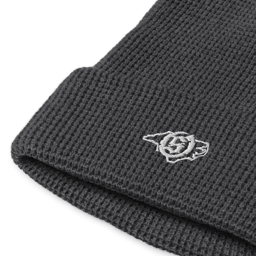 Sail On NC waffle beanie in Heather Charcoal with white thread embroidered logo, close-up view