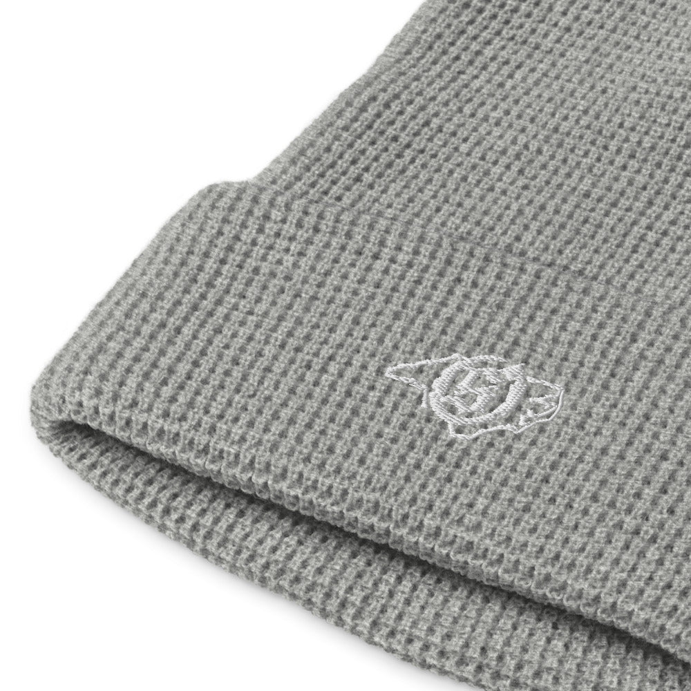 Sail On NC waffle beanie in Heather Grey with white thread embroidered logo, close-up view